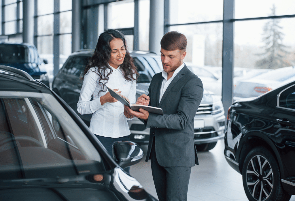 where-i-need-sign-female-customer-modern-stylish-bearded-businessman-automobile-saloon 2
